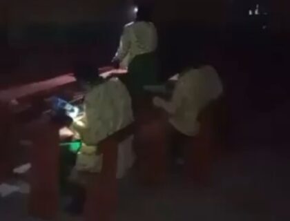 “It’s Not OK!” Public Outrage As Students Take WAEC Exam At Night Using Torchlight In Asaba