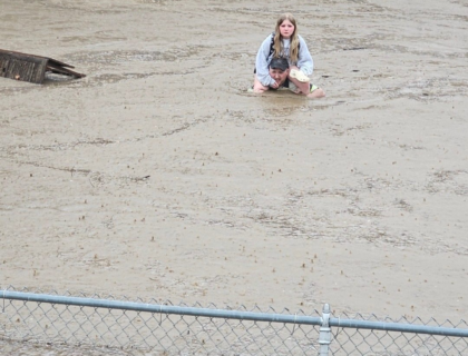 Father Carries Daughter Through Shoulder-Deep Floodwaters From Maryland School
