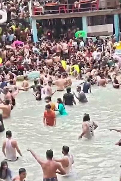 Dozens Of Swimmers Flee Crowded Pool After Huge Snake Spotted In Water 