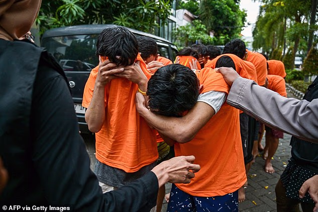 Dozens Of Men Arrested And Paraded By Police Over Alleged Gay Party In Indonesia