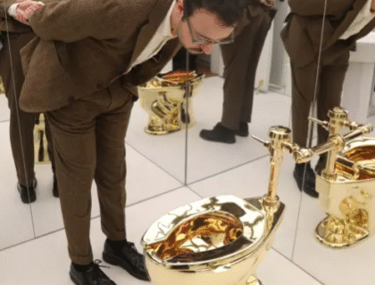 Gold Toilet Named ‘America’ Fetches $12.1 Million At Sotheby’s